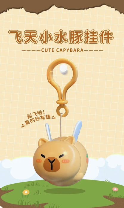 Porte-clé capybara ailé qui tremble en remontant quand on tire le fil