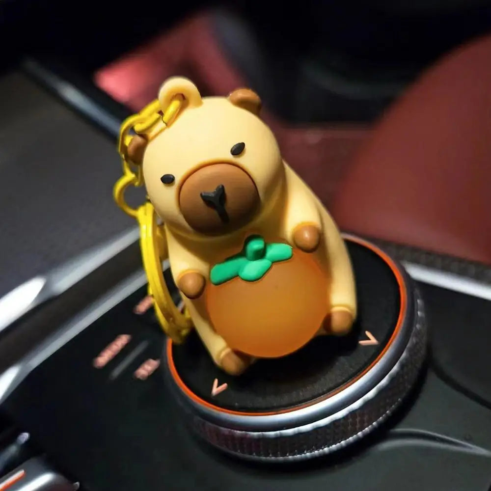 Porte-clé capybara lumineux LED en marron rose ou jaune