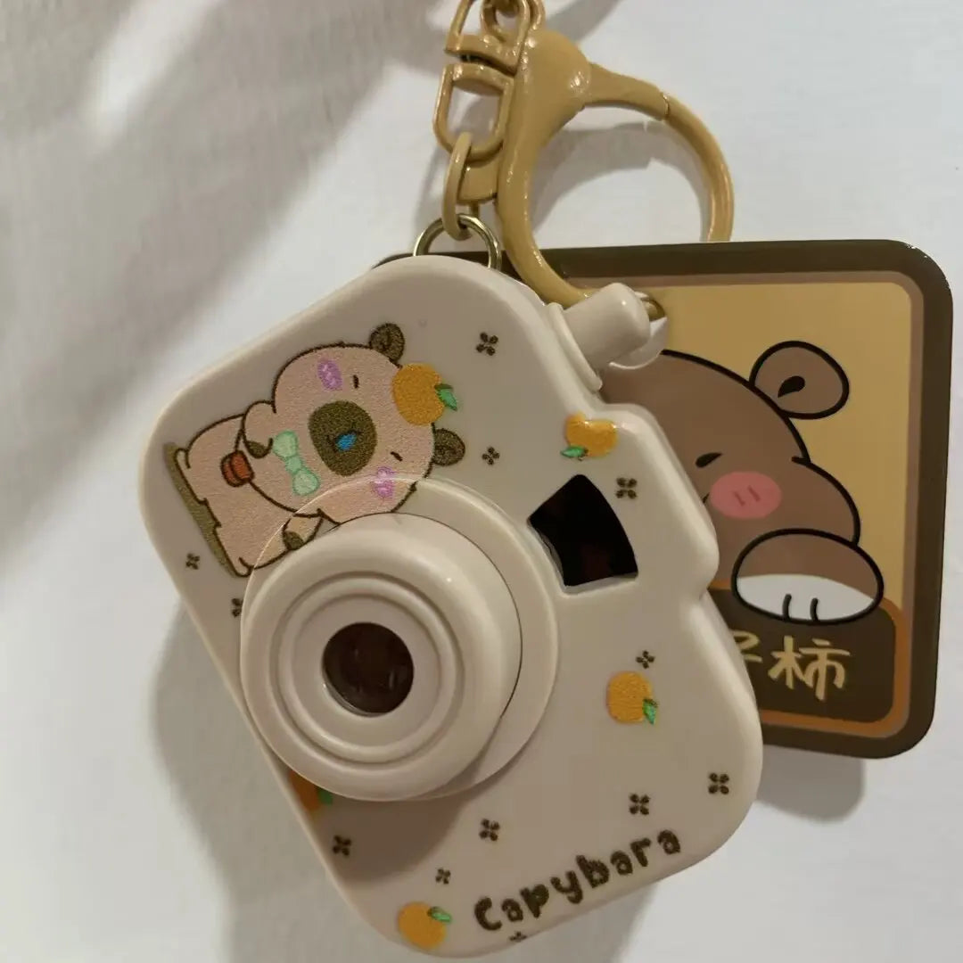 Porte-clé capybara caméra à projection lumineuse
