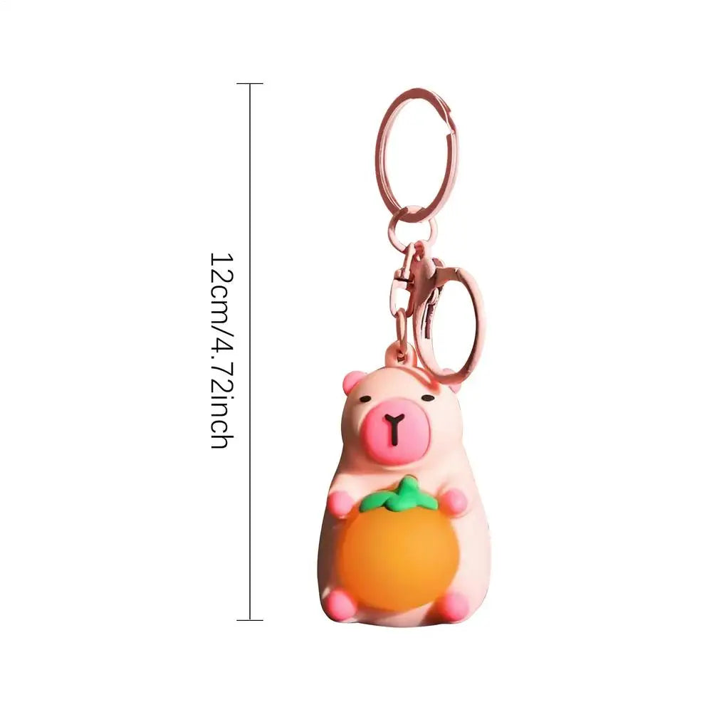 Porte-clé capybara lumineux LED en marron rose ou jaune