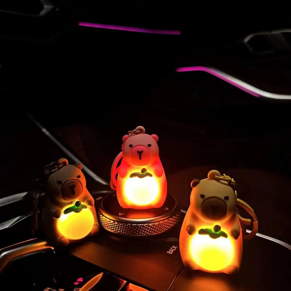 Porte-clé capybara lumineux LED en marron rose ou jaune