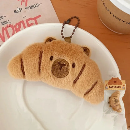 Porte-clé capybara croissant en peluche douce style boulangerie