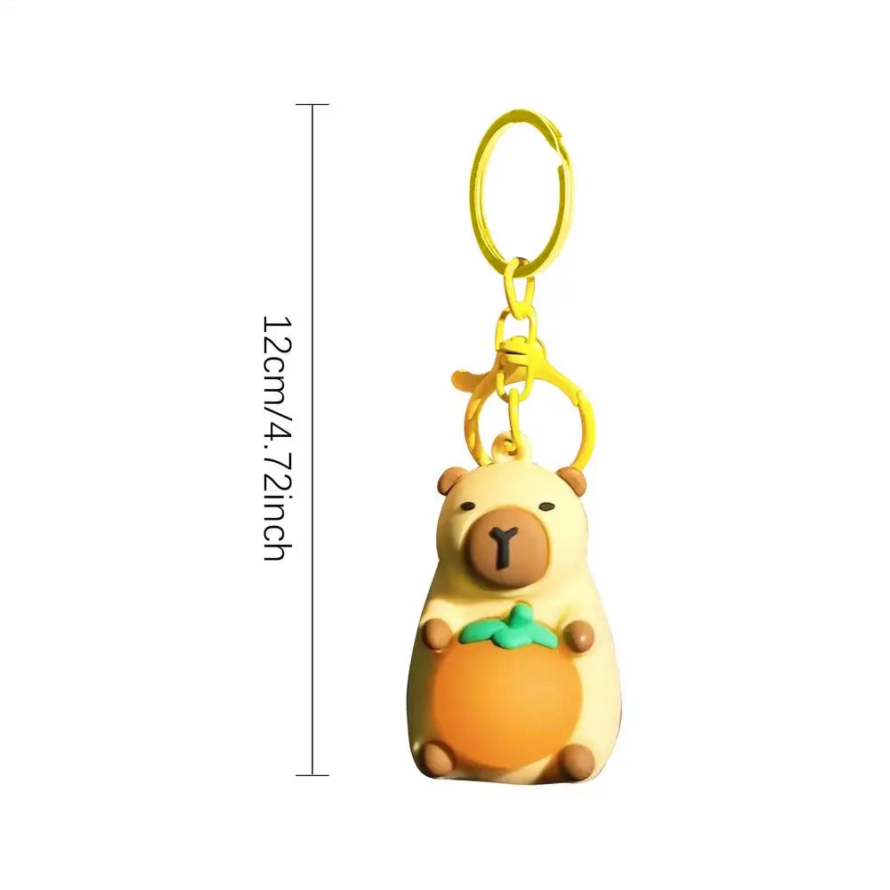 Porte-clé capybara lumineux LED en marron rose ou jaune