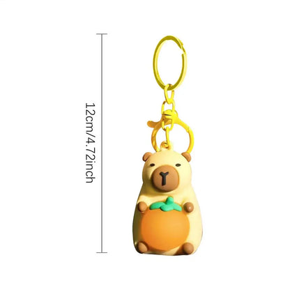 Porte-clé capybara lumineux LED en marron rose ou jaune