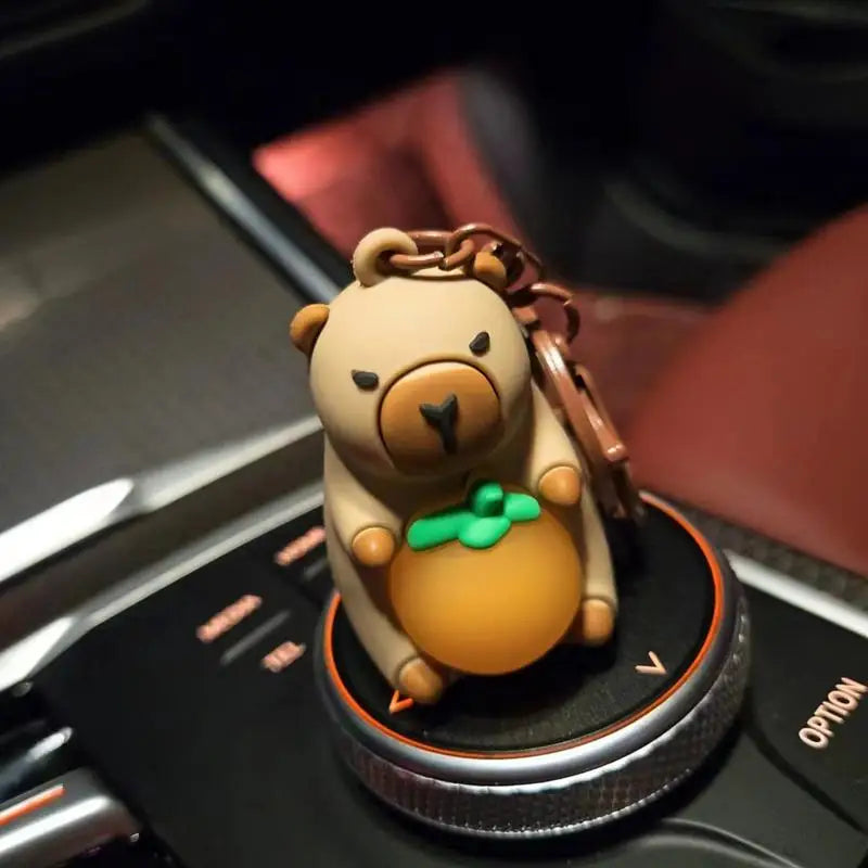 Porte-clé capybara lumineux LED en marron rose ou jaune