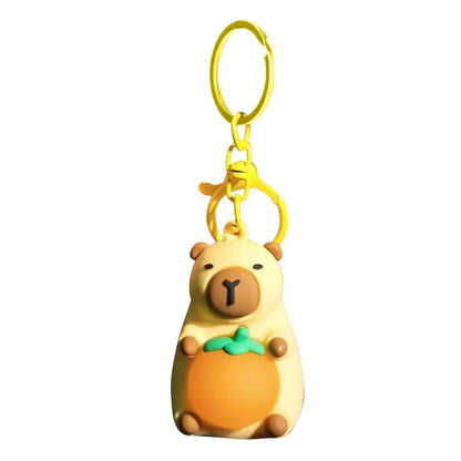 Porte-clé capybara lumineux LED en marron rose ou jaune