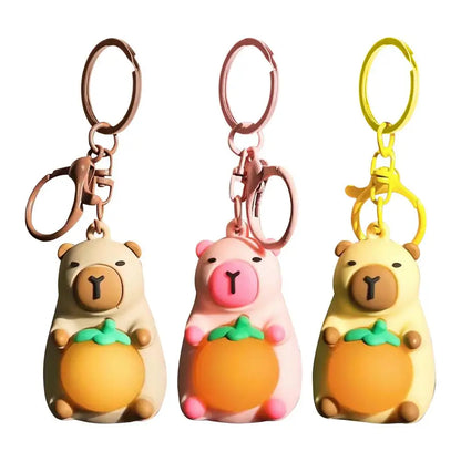 Porte-clé capybara lumineux LED en marron rose ou jaune