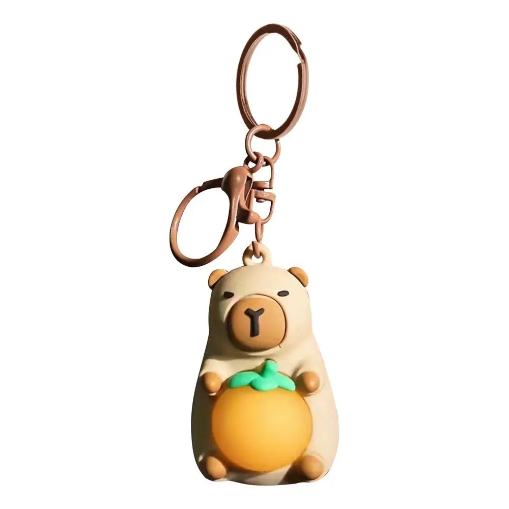 Porte-clé capybara lumineux LED en marron rose ou jaune