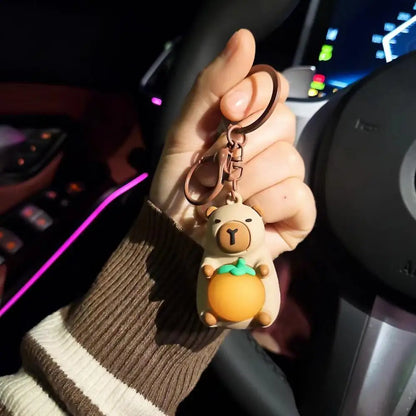 Porte-clé capybara lumineux LED en marron rose ou jaune