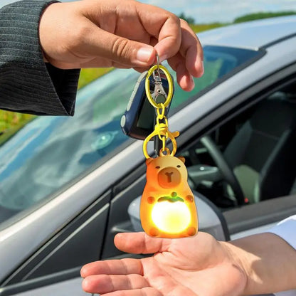 Porte-clé capybara lumineux LED en marron rose ou jaune