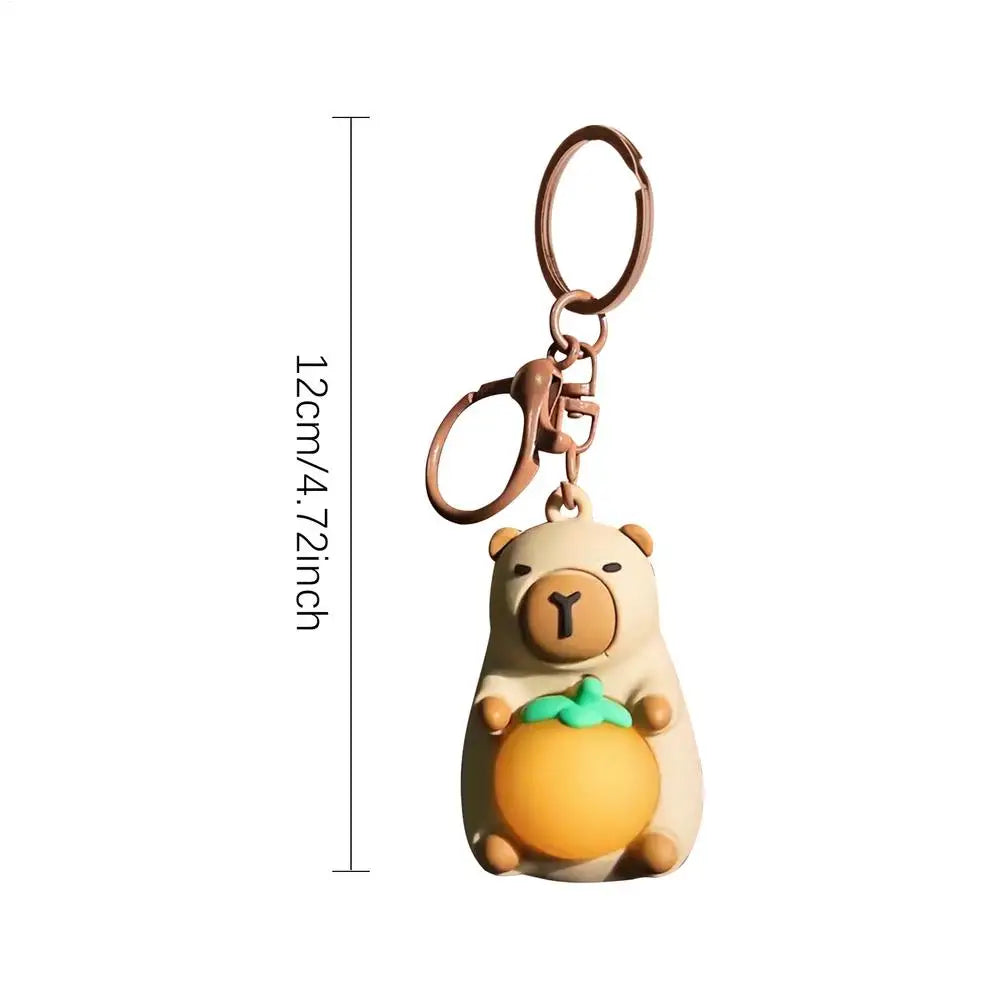 Porte-clé capybara lumineux LED en marron rose ou jaune