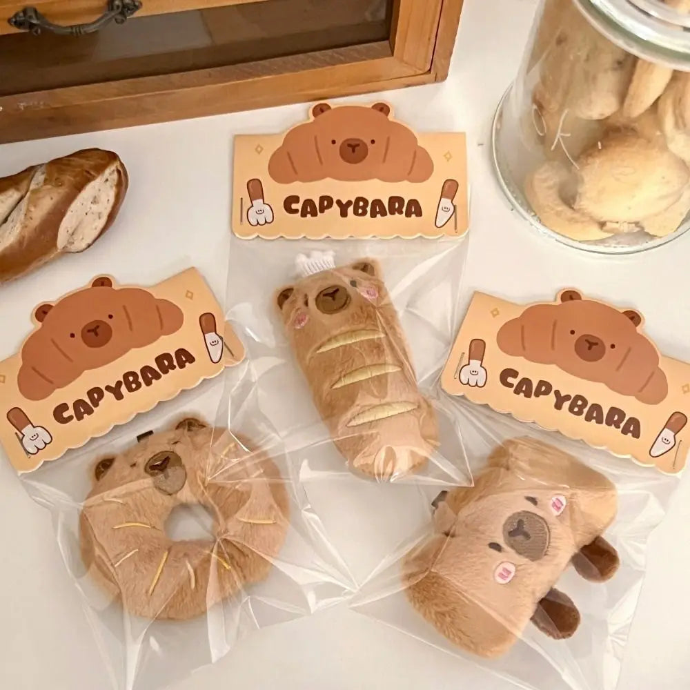 Porte-clé capybara croissant en peluche douce style boulangerie