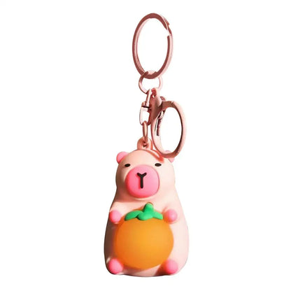 Porte-clé capybara lumineux LED en marron rose ou jaune
