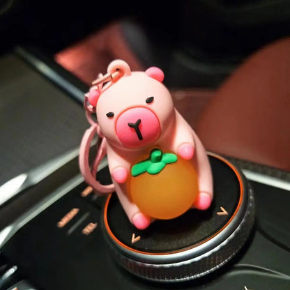 Porte-clé capybara lumineux LED en marron rose ou jaune